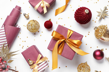 Beautiful composition with different Christmas decorations, gift boxes and wrapping materials isolated on white background