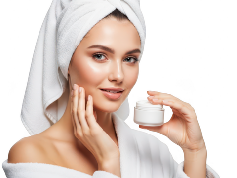 Young woman in towel applying face cream for healthy, radiant skin