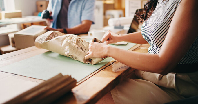 Paper, packaging and hands of woman in office with distribution for delivery, shipping or courier. Ecommerce, package and small business owner with preparation on parcel for cargo, order or process