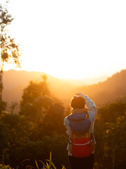 yong woman take a photo of sunrise in the morning