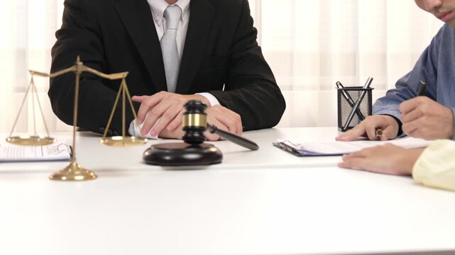 Lawyer act as mediator offer a compromise between two parties to resolve business dispute through negotiation at law firm office. Legal mediation and conflict resolution service. Slow motion. Rigid.