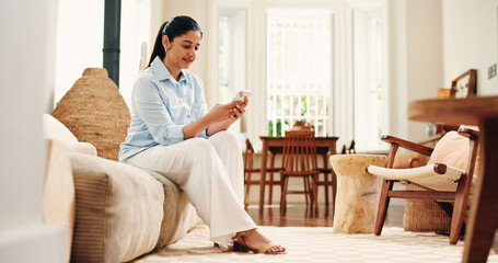 Sofa, reading and happy woman typing with phone on weekend, social network and check message app for alert. Notification, digital communication and person texting in home, email reply and online chat