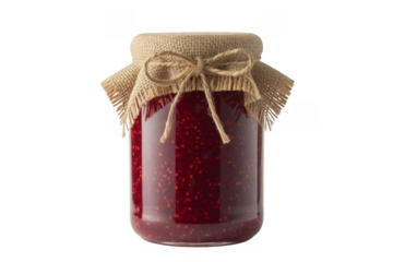 Glass jar filled with vibrant red raspberry jam tied with burlap and twine isolated on a transparent background