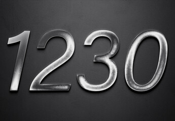 Chrome metal 3D number design of 1230 on grey background.