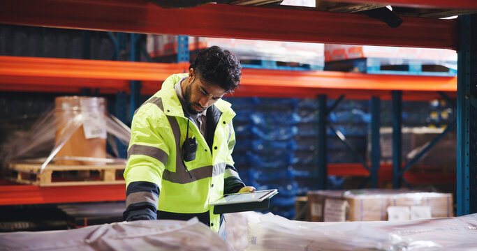 Supply chain, tablet and man in workplace, connection and email for shipping schedule. Person, backlog and employee in factory, quality control and distribution with app for inventory management - Powered by Adobe
