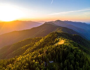 Aerial view of a mountain range at golden hour during sunset