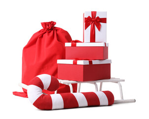 Santa Claus bag with gifts and candy cane isolated on white background