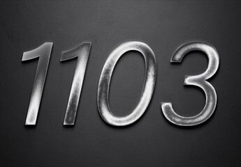 Chrome metal 3D number design of 1103 on grey background.