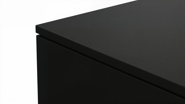 Minimalist black cabinet corner closeup on white background, modern furniture detail, elegant design, clean lines, home interior concept - Powered by Adobe