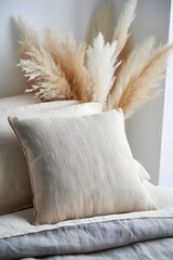 Still life of bedding with pampas grass creating a calm and serene atmosphere