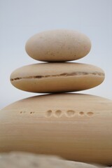 Three stones stacked in balance creating a calming and peaceful zen like atmosphere