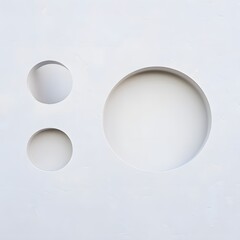 Three white circles on a white background with soft shadows and subtle gradients creating depth