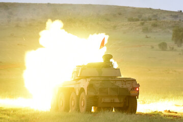 A Rooikat fires its gun during a military live fire demonstartion in South Africa. © Neil