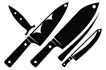 Several black kitchen knives of varied shapes and sizes are arranged together on a white backdrop