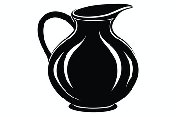 A sleek black pitcher with a handle and spout stands prominently on white