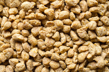 Dry pelleted cat food. Texture of Pet Food