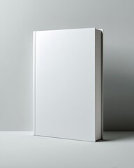 Elegant White Hardcover Book Mockup Standing in a Minimalist Corner with Soft, Diffused Lighting and Subtle Shadows.