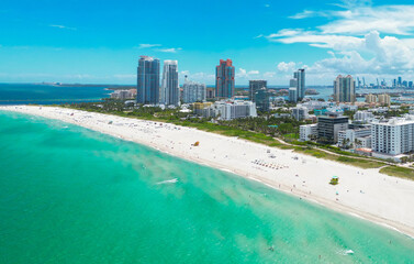 Obraz premium Top view of South Miami Beach and the ocean. Miami skyline with skyscrapers. Aerial view of Miami in summer. Miami shore with luxury buildings. Scenic drone view of Miamis famous coastline.