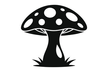 Solid black mushroom with white spots grows among blades of grass below