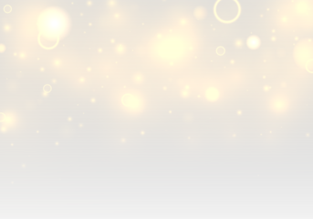 Soft golden dust glows across a gentle bokeh with twinkling highlights and radiant glare. Sparkling yellow particles and shimmering blur add magical Christmas and New Year sparkle.