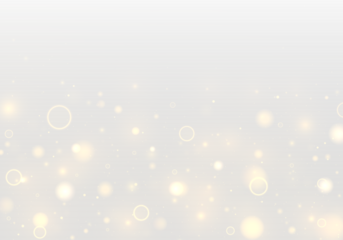 Twinkling golden dust drifts across a soft bokeh background with radiant flare and glowing highlights. Sparkling yellow particles and shimmering blur add a magical Christmas and New Year atmosphere.