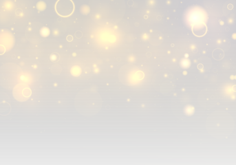 Twinkling golden dust drifts across a soft bokeh background with radiant flare and glowing highlights. Sparkling yellow particles and shimmering blur add a magical Christmas and New Year atmosphere.