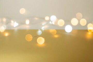 Warm glowing string lights create a festive and elegant ambiance on gold background perfect for holiday promotions and seasonal designs adding a touch of magic