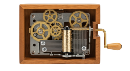 Close-up view of a wooden music box with visible gears and a hand crank.
