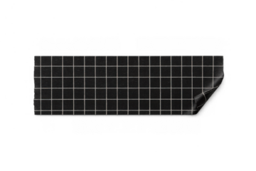 Black graph paper adhesive tape strip with curled corner, offering a versatile design element on transparent background