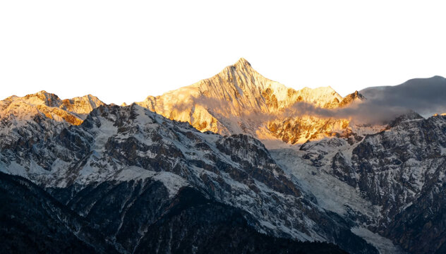 Snow-capped mountain peaks illuminated by golden sunlight at sunrise or sunset