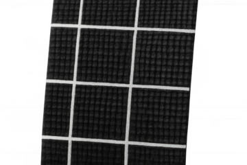 Solar panel surface close-up with photovoltaic cell grid pattern, generating clean renewable energy, black and white texture