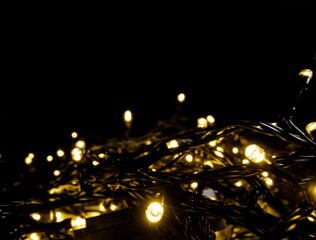 Glowing fairy lights creating festive decoration on dark background
