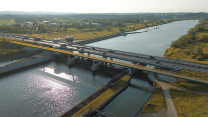 Fototapeta premium Vehicles cross architectural highway structure