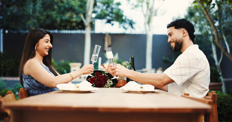Cheers, happy and couple with champagne on date outdoor for valentines day, anniversary or romance. Toast, sparkling wine and man with woman for marriage celebration in backyard at home together.
