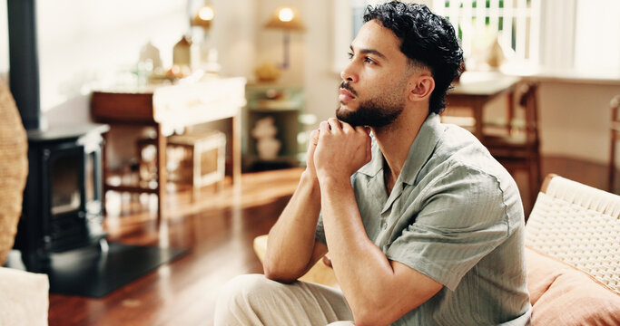 Home, thinking and man on sofa, choice and contemplation with decision, calm and thoughtful. Rest, problem solving and person on couch, nostalgia and planning for daily activity, solution and memory