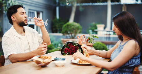 Date, drinking and eating with couple in restaurant together for anniversary, bonding or love. Champagne, food and romance with people at table for fine dining cuisine, gourmet meal or pasta dish