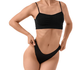 Young woman in underwear on white background. Liposuction concept