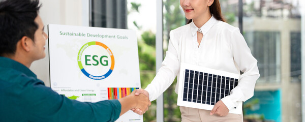 ESG Partnership. Professionals shaking hands over Sustainable Development business goal.