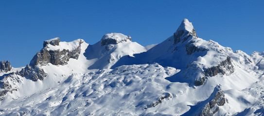 Snow covered mountains Chaiserstock and Chronenstock, view from the Stoos ski area, Switzerland.