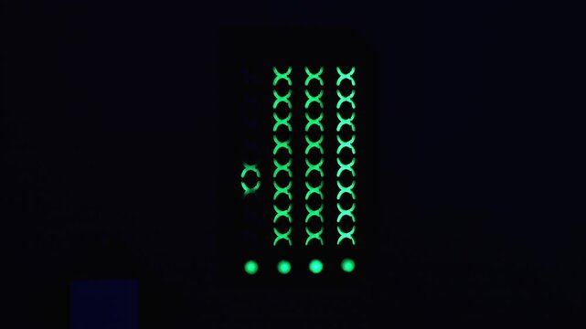 A glowing neon trail of crosses or neon glow on wallpaper with texture, pattern or reflection in the form of binary abstraction. A dark wall with neon green crosses.