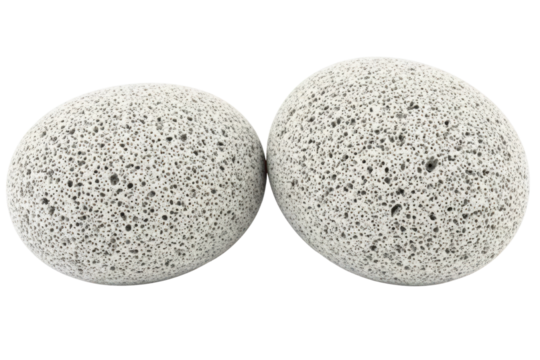 Two grey porous pumice stones for foot care and beauty spa treatment isolated on a transparent background