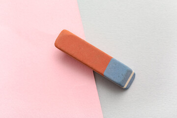 School eraser on color background