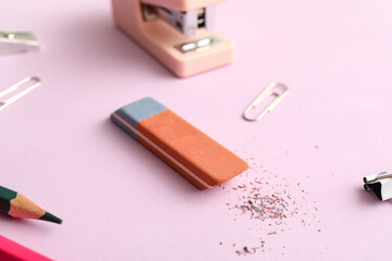 School eraser on lilac background