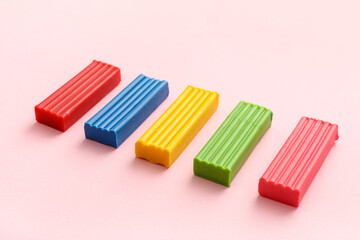 Fototapeta premium Colorful plasticine on pink background