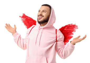 Young man in hoodie with Cupid's wings on white background. Valentine's Day celebration