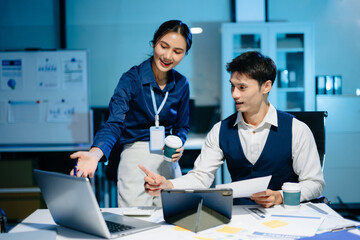 Professional Asian colleagues communicating in a modern office, teamwork and collaboration for successful business projects.