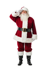 Elderly caucasian man as santa claus in a red velvet suit on a white background, looking into the distance with hopeful anticipation. Holiday season spirit