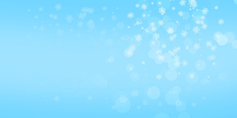 Fototapeta premium Blue background. Winter background, snowflakes on a beautiful background, Christmas background for cards, snowfall. Snowy natural scenery, forming bokeh lights.