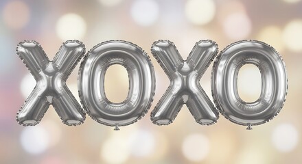 Shiny silver foil balloons spelling xoxo against a softly blurred bokeh background