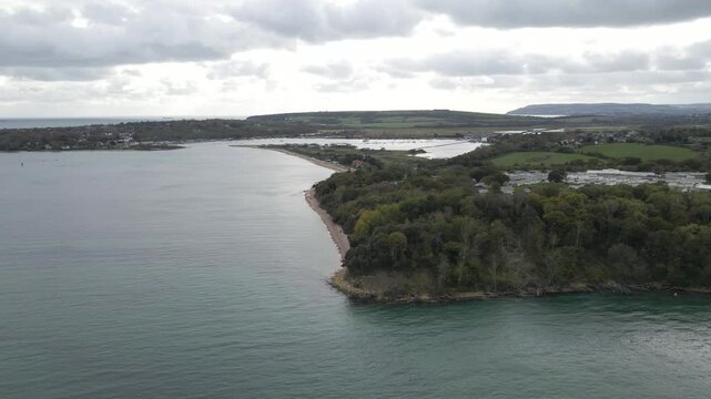 Aerial view of St Helens village named in dedication to St Helena Church, a destroyed church built in the 12th century Cluniac priory. Only the tower of the church remains, drone slowly moving forward